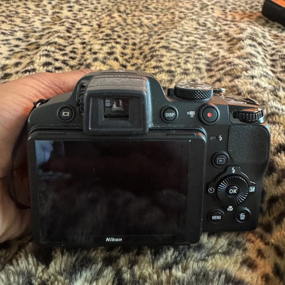 Nikon Black Camera with White Accessories